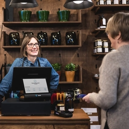 two ladies in a flower shop and talech register
