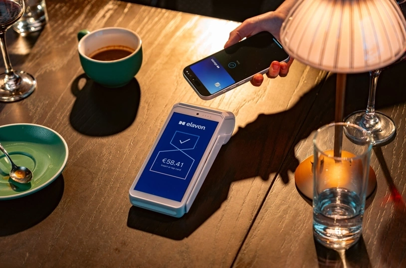 Paying for a coffee in a café