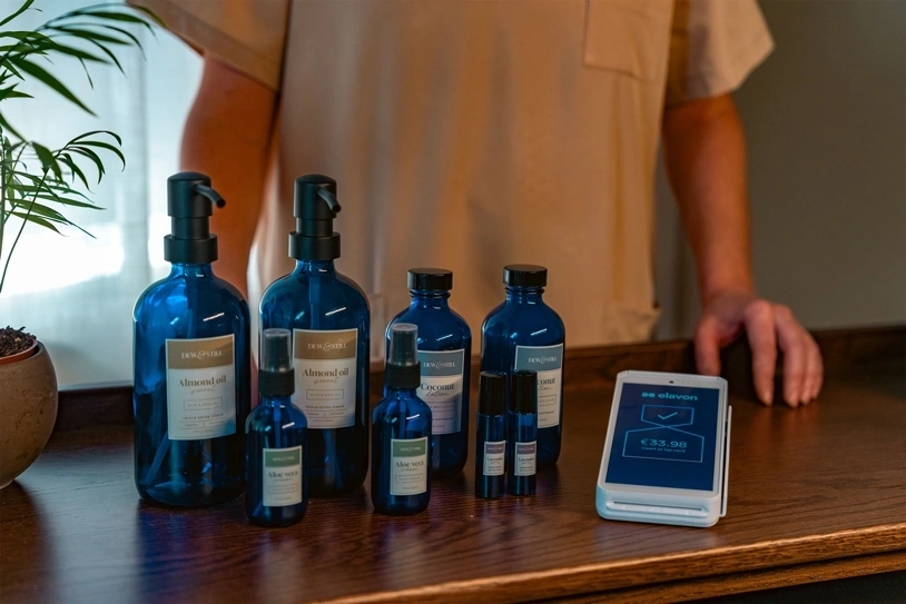 Hotel spa front desk displaying retail products beside a card payment terminal ready for customer checkout